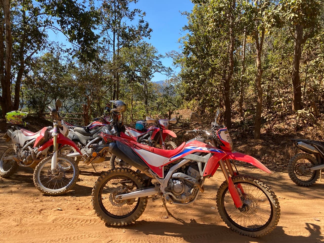 Group climbing red dirt out of the foothills.