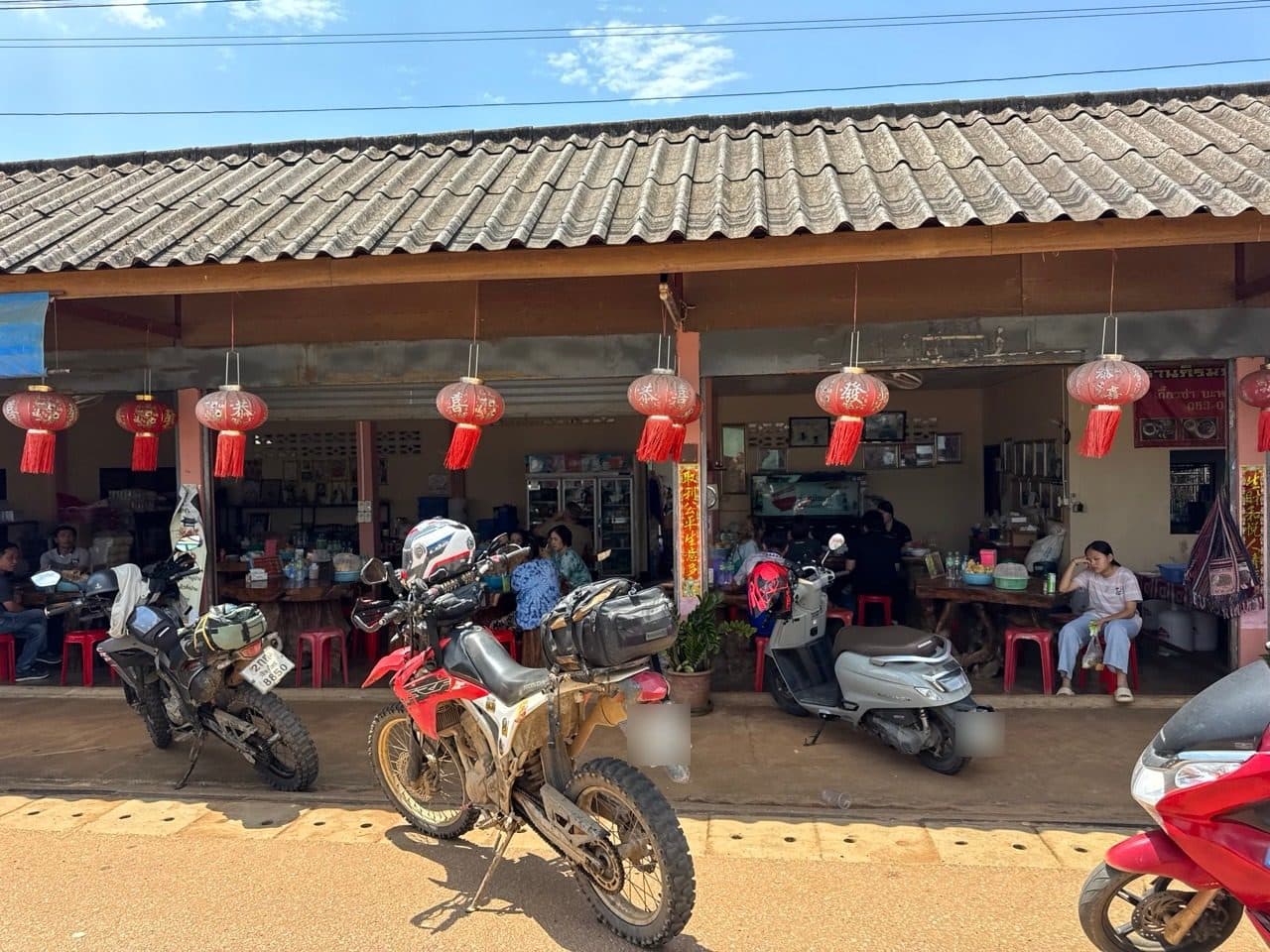 Both bikes outside the noodle shop in Arunothai.