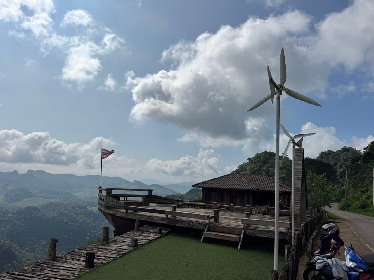 The deck at Ban Jabo, with the wind turbines on the ridge behind.