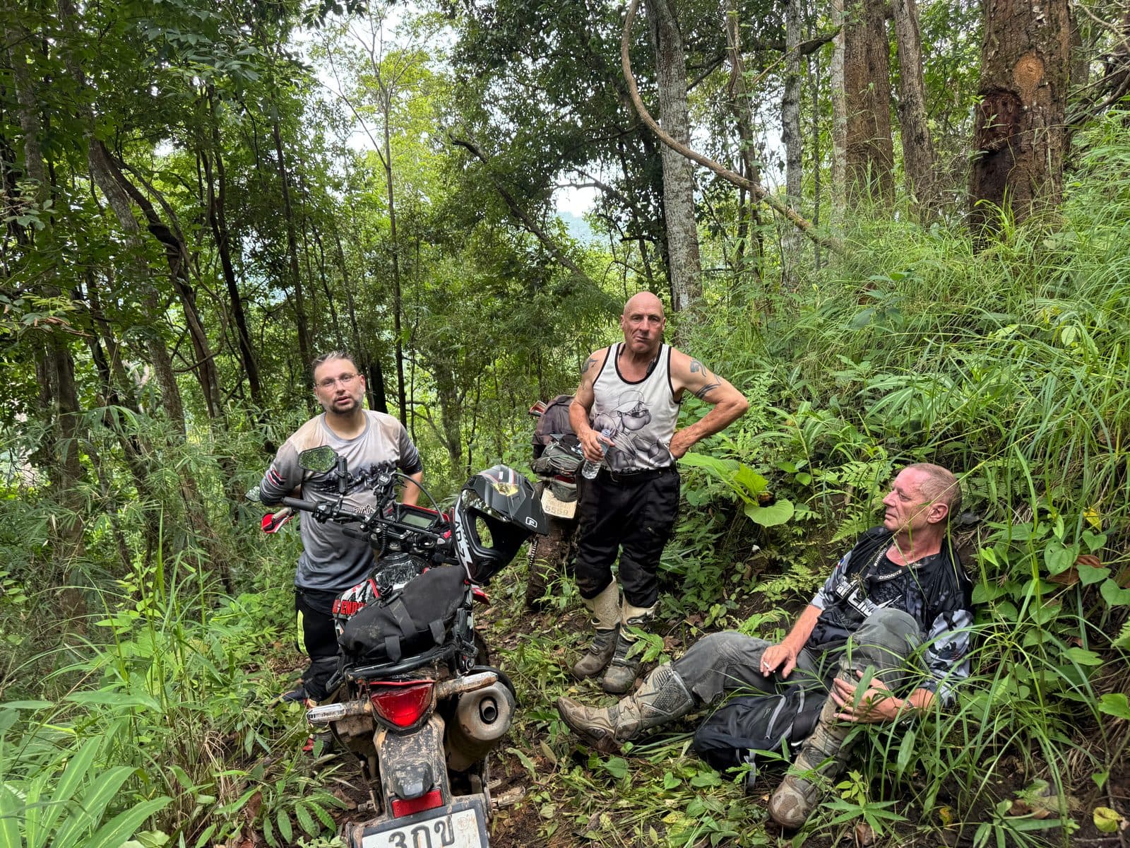 Regrouped on the hillside. Gear off, water out, seven kilometres covered in ninety minutes.