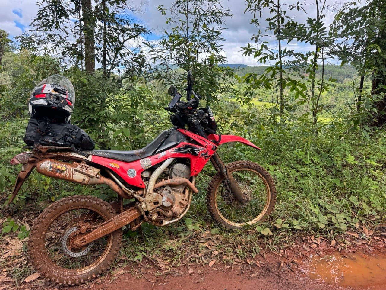 The CRF250L caked to the axles by early afternoon