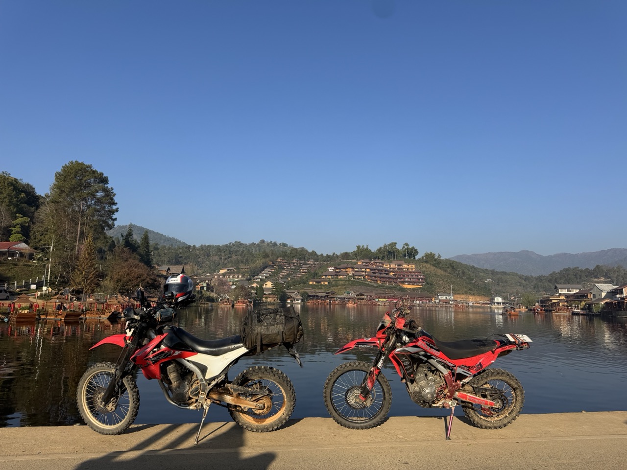 Dirt bikes lined up at a rental shop in Chiang Mai
